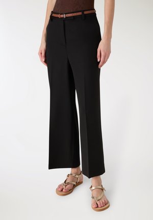 - Spodnie materiałowe