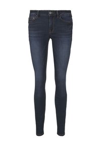 Jeans ajustados de mezclilla azul oscura, con una cintura de media altura, bolsillos frontales y costuras visibles. Textura suave con ligero estiramiento.