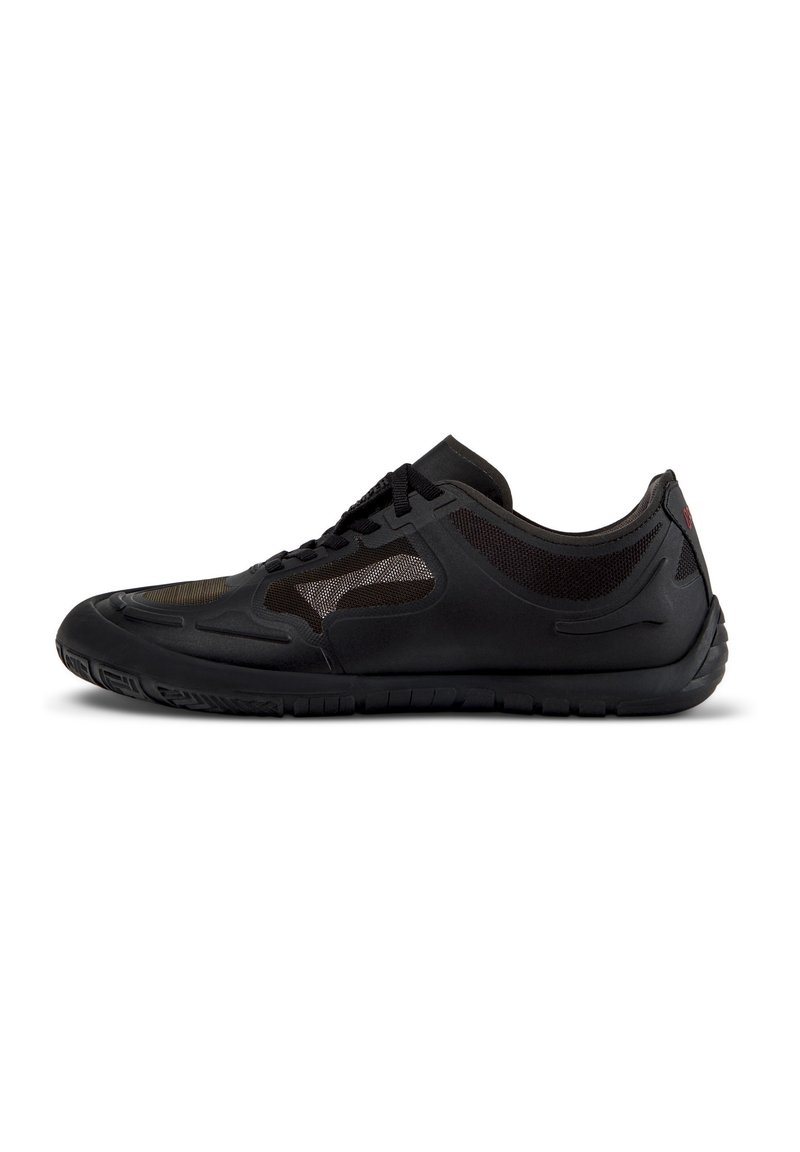 Black athletic shoe with a textured synthetic upper, mesh panels for breathability, and a rubber sole with a patterned tread.