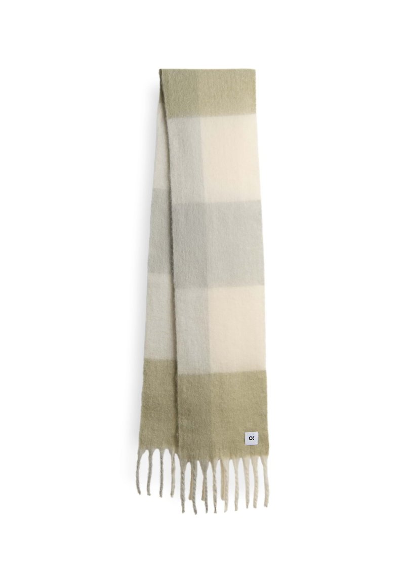 Sciarpa di lana in un motivo a quadri leggero verde, grigio e crema. Presenta bordi frangiati e un piccolo etichetta del marchio. Texture morbida.