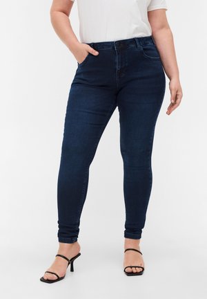 Dunkelblaue Skinny-Jeans aus Denim mit hoher Taille, fünf Taschen, einem Knopfverschluss vorne und Knöchellänge.