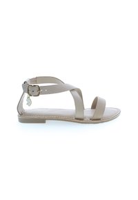 Platt beige sandal med korsremmar, justerbar vristspänne och en liten charm. Slät lädertextur och minimalistisk design.