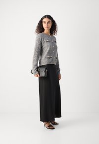Lindex LUMI - Adīta jaka - black