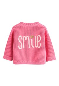 Maglione rosa lavorato a maglia con vestibilità comoda. "Smile" è ricamato in bianco con un piccolo accento a forma di cuore, con polsini e orlo a coste.
