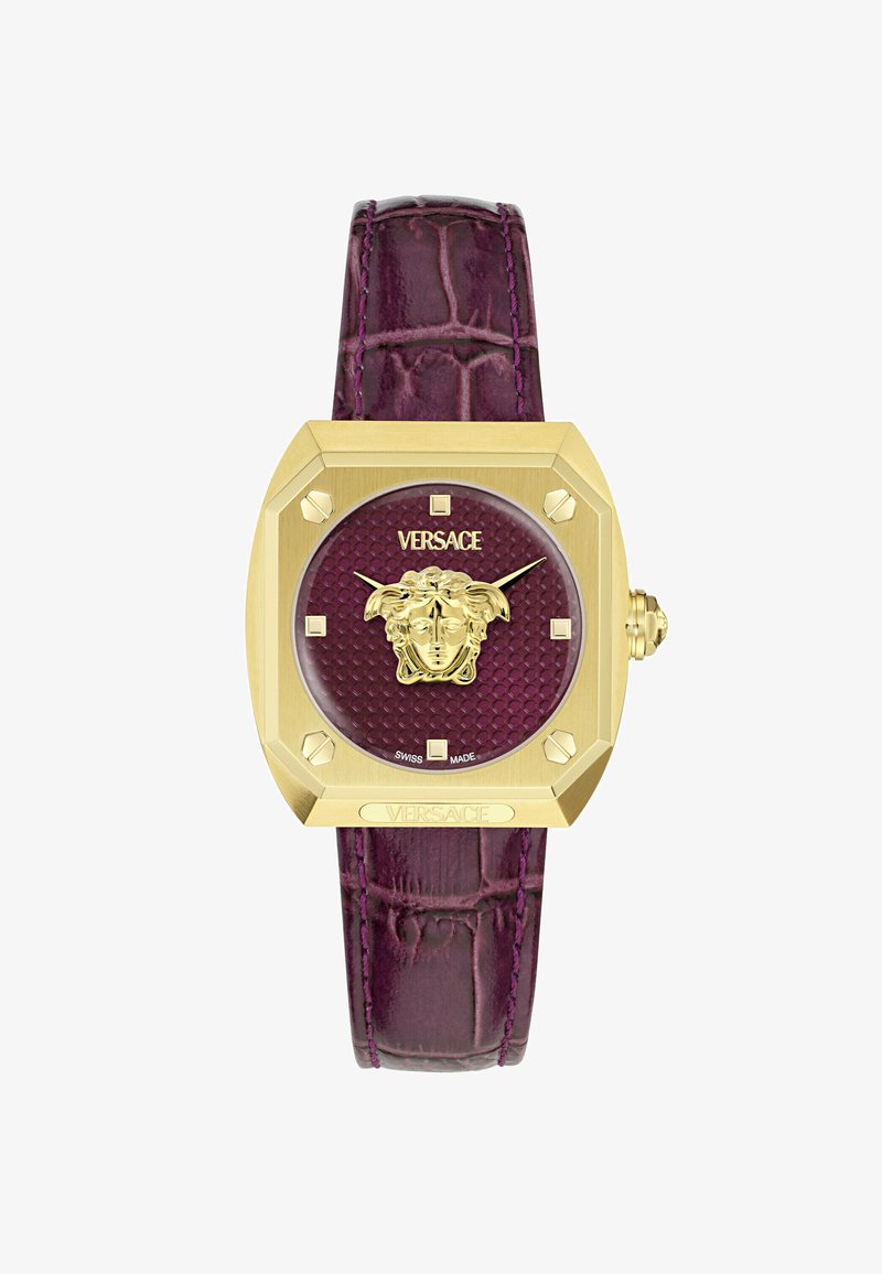 Zelta kvadrātveida Versace pulkstenis ar teksturētu purpura ciparnīcu, Medūzas galvas emblēmām un purpura aligatora ādas siksniņu.