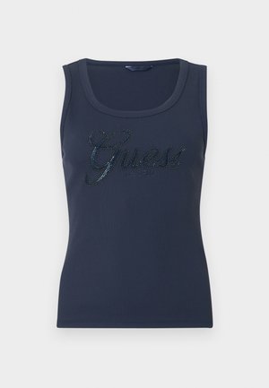 Navy blue ribbed sleeveless top with scoop neck and "Guess est. 1981" logo in rhinestones across the chest.