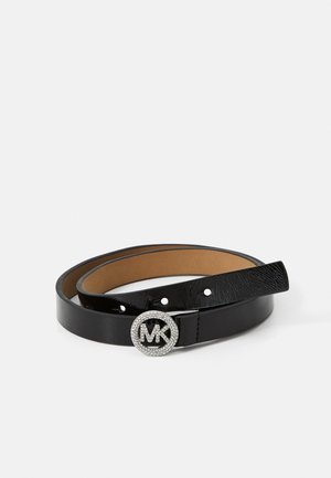 Black leather belt with a shiny, round silver-tone buckle featuring a crystal-encrusted "MK" logo and adjustable holes for sizing.