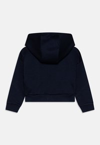 Marinblå croppad hoodie med en dragsko i huvan, långa ärmar och ribbad fåll. Tillverkad av mjukt material med en slät yta.