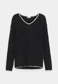 Svart stickad tröja med långa ärmar och V-ringning. Har en kontrasterande krämfärgad kant längs halsringningen och nederkanten. Löst passform.