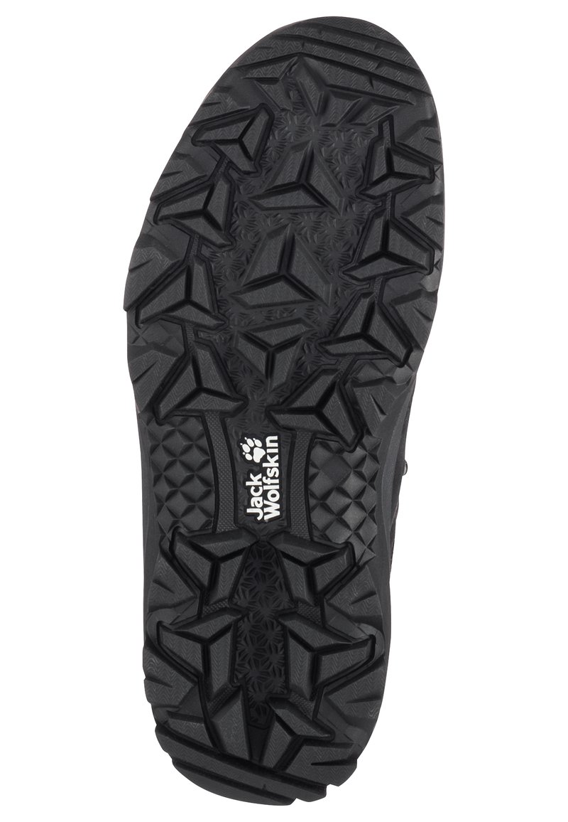 Semelle de chaussure en caoutchouc noir avec un motif de semelle texturé et multidirectionnel, ainsi qu'un logo en relief avec "Jack Wolfskin". Les bords renforcés augmentent la durabilité.