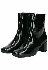 Bottines en cuir verni noir avec un bout carré, fermeture éclair sur le côté et un petit talon carré. Texture lisse avec une finition brillante.