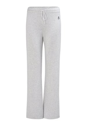 Pantalon de survêtement gris clair à jambes larges, avec taille élastique, cordon de serrage, et petit logo brodé noir près de la taille sur fond blanc.