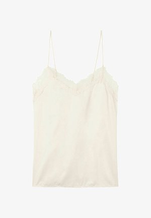 Cream camisole with lace trim at the neckline and straps, made of soft fabric with a smooth texture, featuring a slightly loose fit.