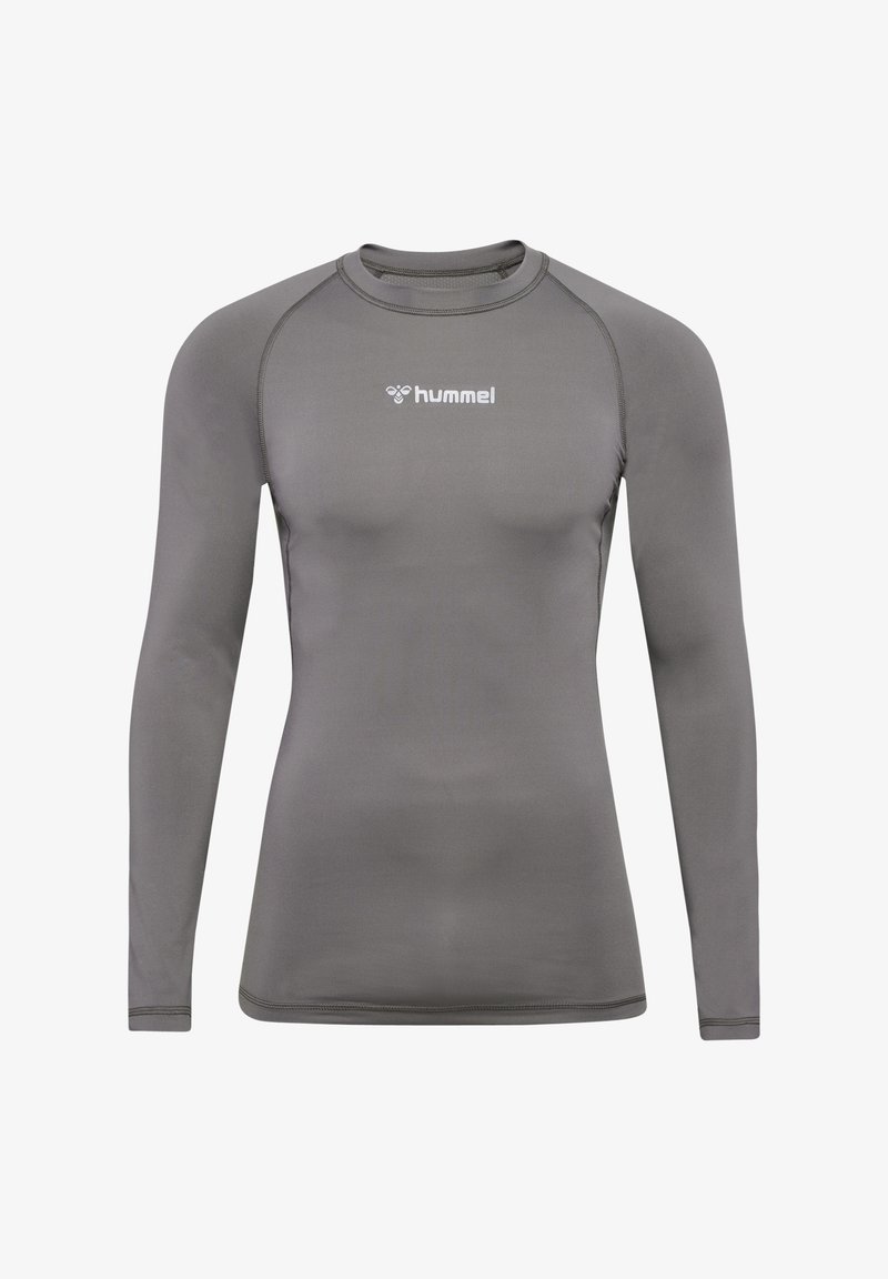Langærmet træningsshirt i gråt stof med en tætsiddende pasform, rund halsudskæring og hvidt "hummel"-logo på fronten. Glat tekstur.