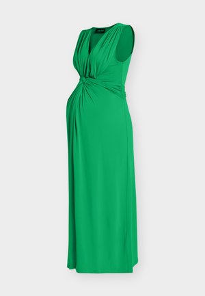 Sleeveless green maternity dress with gathered detailing at waist and V-neckline, floor-length, flowy fabric.