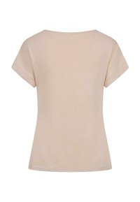 Haut beige à manches courtes avec un col rond, fabriqué en coton doux, présentant une silhouette légèrement évasée et sans embellissements visibles.