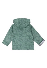 Veste de pluie verte avec motif de dinosaure, à capuche, à manches longues, ornée d'accents bleus aux poignets et fabriquée en matériau léger et imperméable.