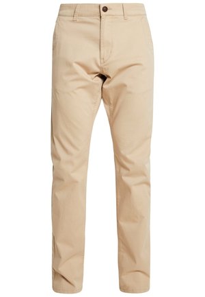 Beżowe chinosy o prostych nogawkach z zapięciem na guzik i zamek z przodu, szlufkami na pasek oraz bocznymi kieszeniami.