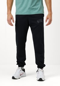 Nike Performance JOGGER - Tepláky - black/white