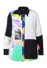 Chemise à manches longues avec un mélange de motifs géométriques audacieux dans des couleurs comme le violet, le noir, le blanc, le vert et le rose ; fabriquée en tissu léger.