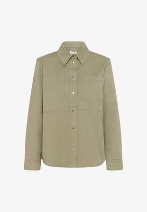 Chemise olive en coton à manches longues, avec un col, une poche poitrine et des boutons-pression en métal.