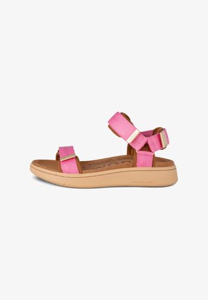 Pink adjustable sandal with wide straps, soft interior, and a beige rubber sole. Features a textured design on straps and branding on the sole.