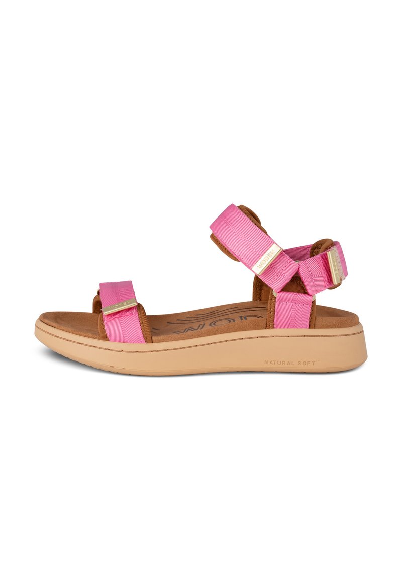 Pink adjustable sandal with wide straps, soft interior, and a beige rubber sole. Features a textured design on straps and branding on the sole.