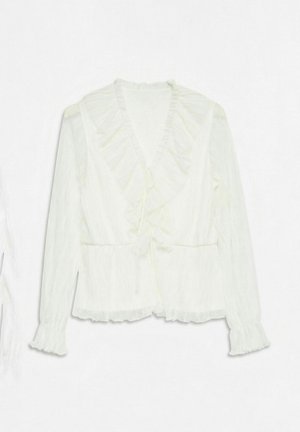 Biała bluzka z długim rękawem, z falbankowym kołnierzykiem, zawiązywana z przodu, z teksturowanej tkaniny, z falbankami na mankietach i u dołu.