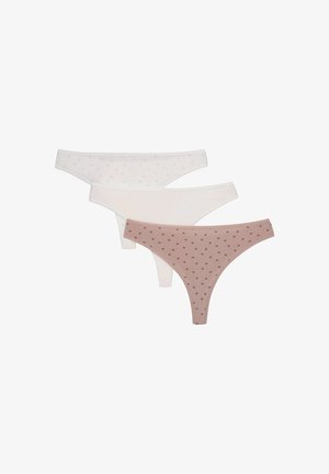 Zestaw trzech stringów: jeden jasnoróżowy w kropki, jeden biały w kropki i jeden gładki biały. Gładka tkanina, prosty design.