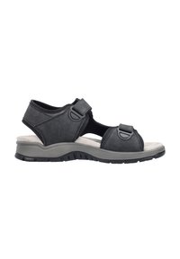 Black sandal with adjustable straps, soft upper material, cushioned footbed, and a durable rubber sole. Features round accents on straps.