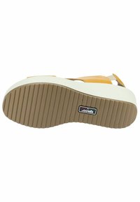 Sandalo platform con tomaia in pelle color cuoio, suola crema chiara e suola esterna rigata marrone. Presenta un'etichetta con il marchio sul fondo.