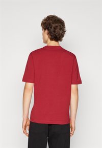 BOSS TCHUP - T-shirts - open red