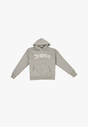 Hall halliga kapuutsiga dressipluus esetaskuga, millel on heledas roosas kirjas "Dropsie". Kangas tundub pehme ja varrukatel on soonilised mansetid.