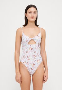 Maillot de bain une pièce avec un motif floral aux couleurs pastel, un détail découpé à l'avant et des bretelles spaghetti réglables.