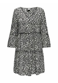 Vestido floral en blanco y negro con mangas largas, escote en V, capas en cascada y una tela ligera y fluida. Presenta pequeños patrones de flores.