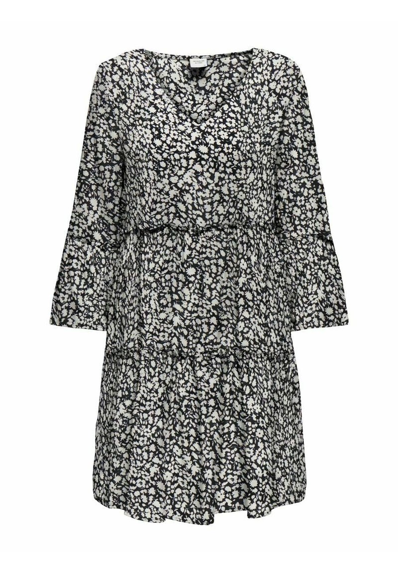 Vestido floral en blanco y negro con mangas largas, escote en V, capas en cascada y una tela ligera y fluida. Presenta pequeños patrones de flores.