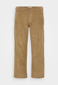 Pantalons en velours côtelé de couleur marron clair, présentant un design à jambe droite, des passants de ceinture et des poches avant. Surface texturée avec des nervures verticales.