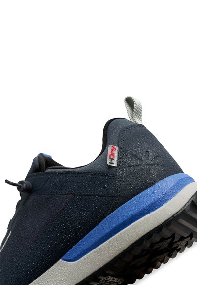 Navy blue waterproof shoes with a textured upper, featuring gray and blue accents, a rubber sole, and a reflective pull tab.