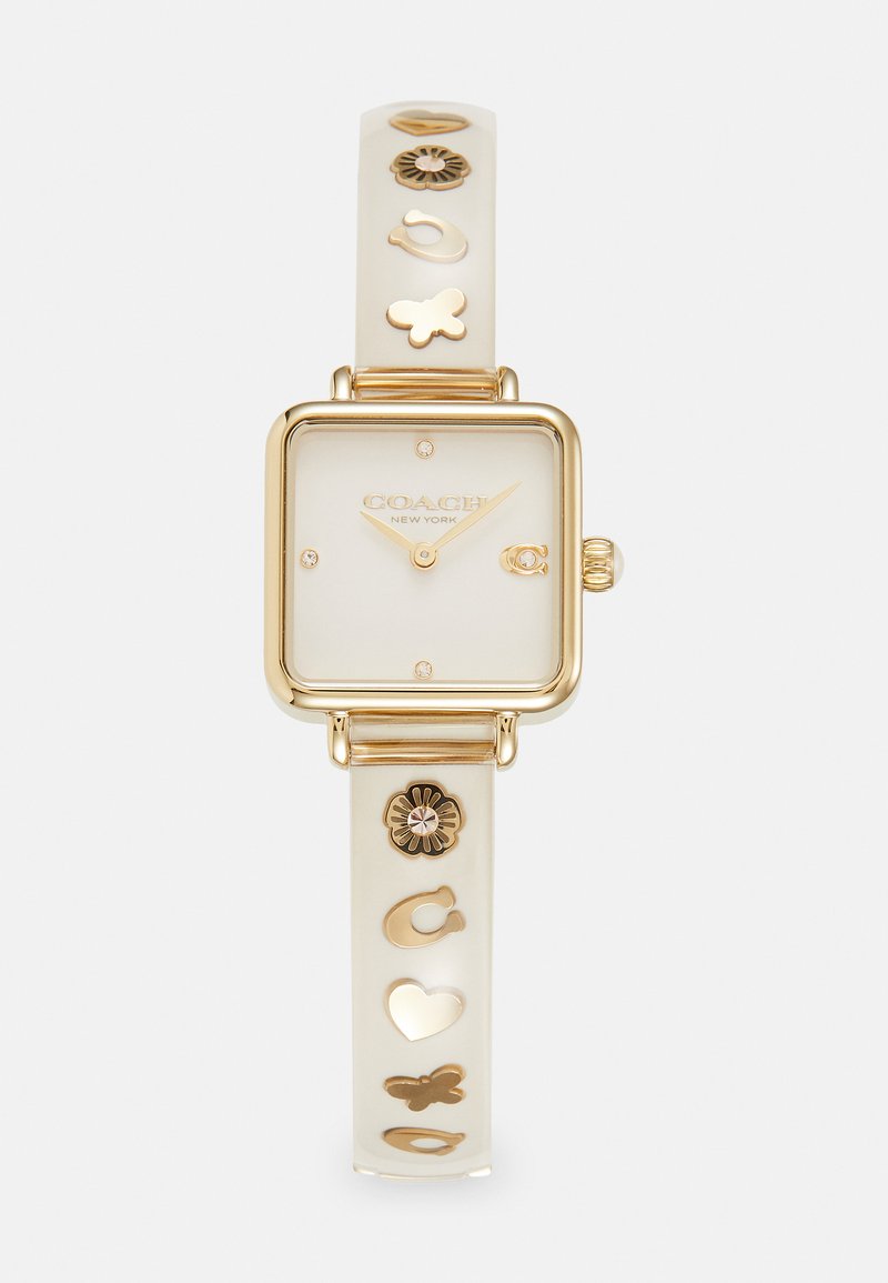 Quadratisches Armband mit einem Gehäuse aus goldfarbigem Metall, cremigem Zifferblatt und einem durchsichtigen Armband, das goldene Charms in Form von Herzen, Schmetterlingen und Blumen aufweist.