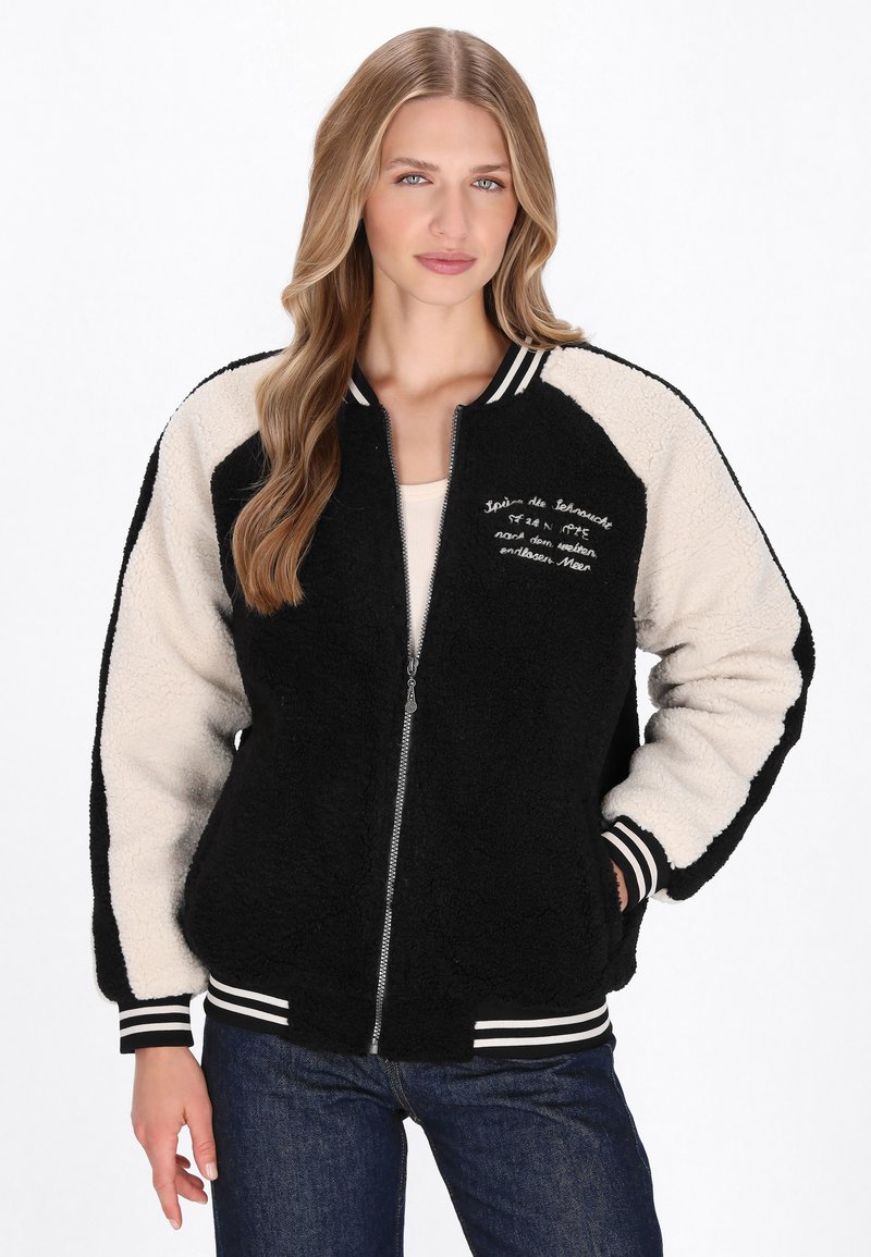 Sort og cremefarvet farveblokkeret bomberjakke lavet af tekstureret fleece, med lynlås foran, ribbede mansetter og broderede detaljer.