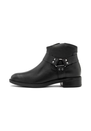 Black leather ankle boot featuring a rounded toe, buckle strap detail, and low block heel with a textured outsole for grip.