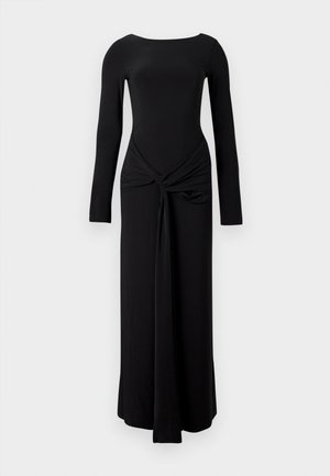 Vestido negro de manga larga con un cuerpo ajustado, escote redondo y detalle anudado en la cintura, que fluye en una silueta recta.