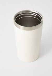 Insulated travel mug made of white stainless steel with a metallic rim, cylindrical shape, smooth matte texture, and a dark interior.