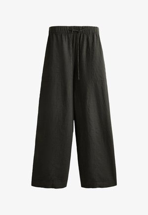Dunkelgrüne weit geschnittene Hose aus strukturiertem Stoff, mit einem elastischen Bund und Kordelzug sowie zwei aufgesetzten Taschen.