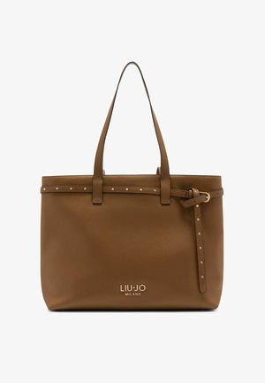 Pruun nahast käekott kahe käepidemega, reguleeritava rihmaga ning dekoratiivsete kuldsete nööpidega ülevalt. Logo on esiküljel reljeefselt kujutatud.