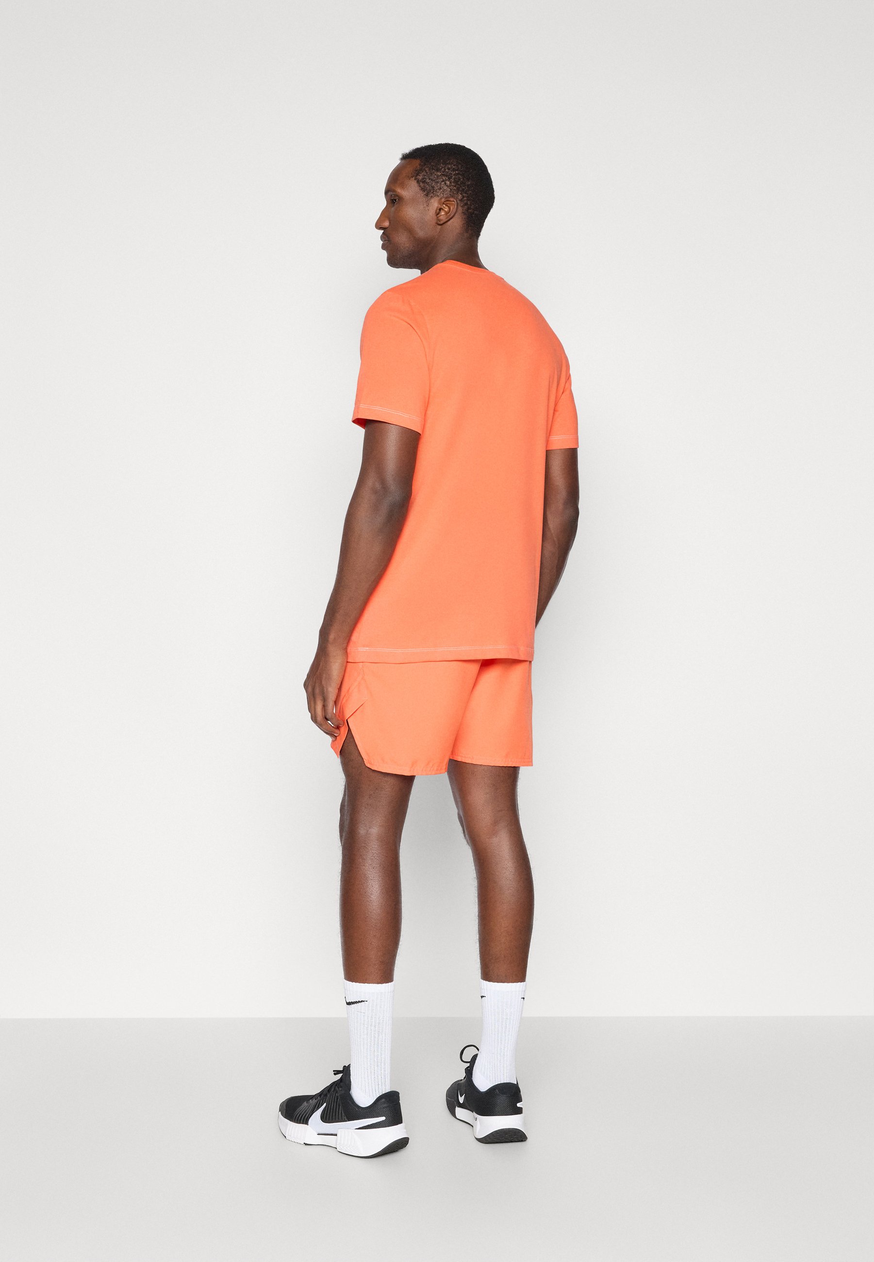 turf orange nike shorts