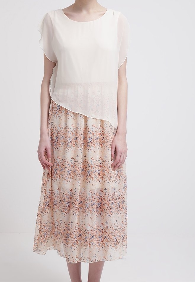 Hellästi laskeutuva, kermaisenvärinen mekko, jossa on läpikuultava päällikerros ja oranssin ja sinisen sävyinen kukkakuosi hameosassa, polvipituinen ja pyöreällä pääntiellä.