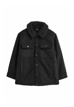 Veste noire avec un col duveteux et texturé et des fermetures à boutons. Dispose de deux poches poitrine et d'une poche latérale supplémentaire.