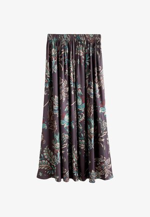 Ziedu raksta svārki tumši violetā audumā ar lieliem zaļiem, tirkīza un bordo rakstiem. Ar krokotām locījumu līnijām un elastīgu jostu augšpusē.