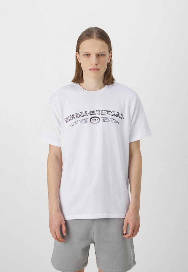 White cotton t-shirt featuring black text that reads "METAPHYSICAL" with decorative leaves above and below, complemented by a round logo.